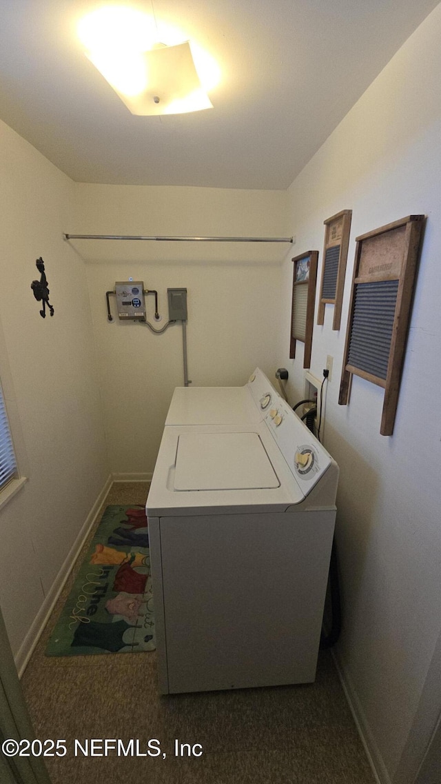 laundry room with baseboards, washer / dryer, and laundry area