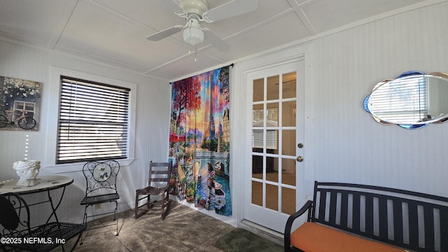 living area featuring a ceiling fan