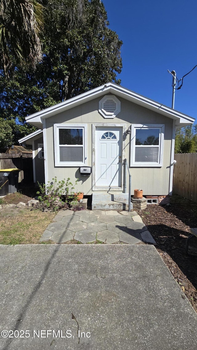 view of front of house with fence