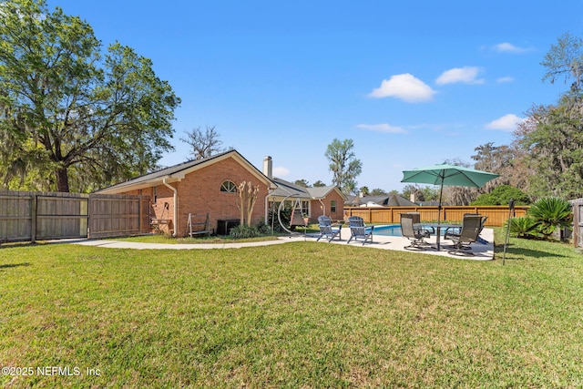 view of yard with a patio area and a fenced backyard