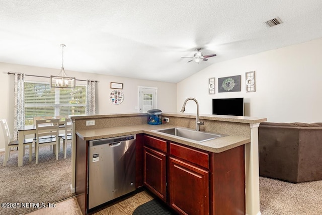 kitchen featuring visible vents, a sink, open floor plan, dishwasher, and reddish brown cabinets