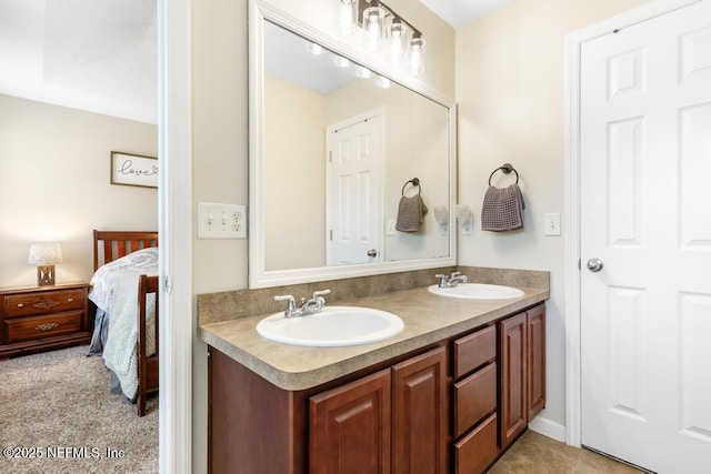 ensuite bathroom with double vanity, ensuite bathroom, and a sink