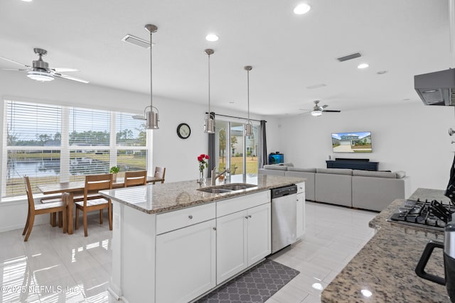 kitchen with a sink, stainless steel appliances, visible vents, and white cabinets