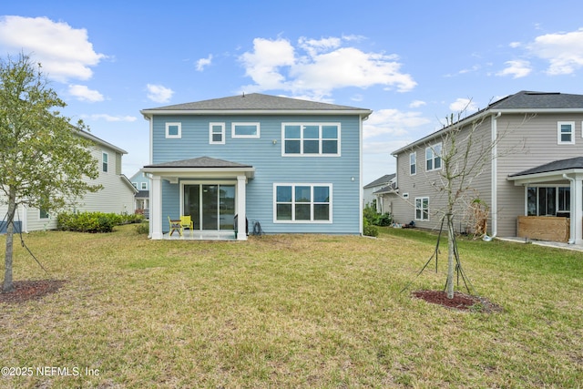 54 Ness Cir, Saint Augustine, FL 32095 - rear view of property featuring a lawn