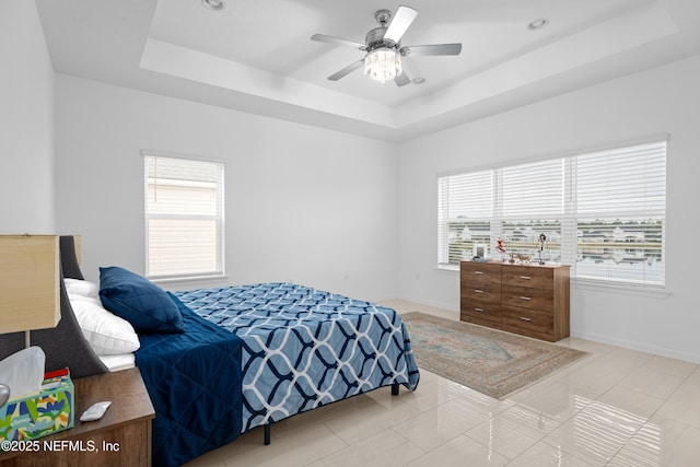 54 Ness Cir, Saint Augustine, FL 32095 - bedroom featuring light tile patterned floors, baseboards, a raised ceiling, and ceiling fan