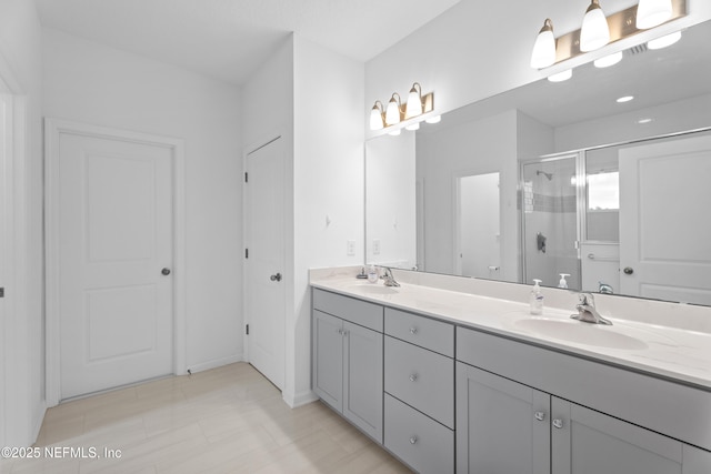 54 Ness Cir, Saint Augustine, FL 32095 - bathroom featuring a sink, double vanity, and a shower stall