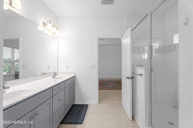 54 Ness Cir, Saint Augustine, FL 32095 - bathroom with a stall shower, visible vents, and a sink