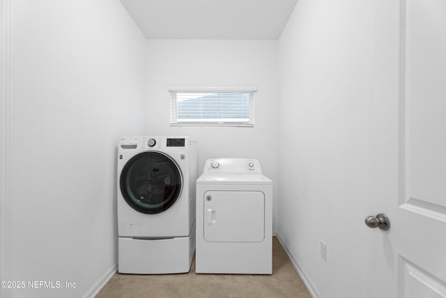 54 Ness Cir, Saint Augustine, FL 32095 - laundry area with laundry area, baseboards, and washing machine and clothes dryer