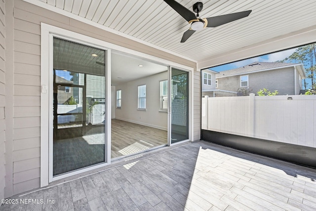 view of patio / terrace with a ceiling fan and fence