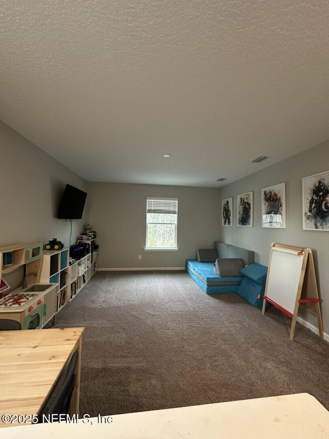 carpeted living room featuring visible vents, baseboards, and a textured ceiling