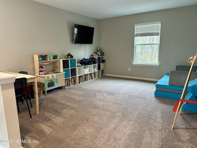 playroom with carpet flooring and baseboards