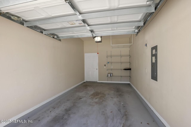 garage with electric panel, a garage door opener, and baseboards