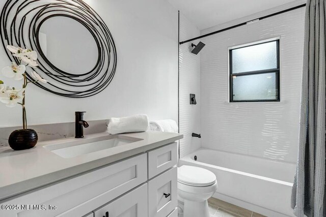 bathroom with toilet, vanity, and shower / bath combination with curtain