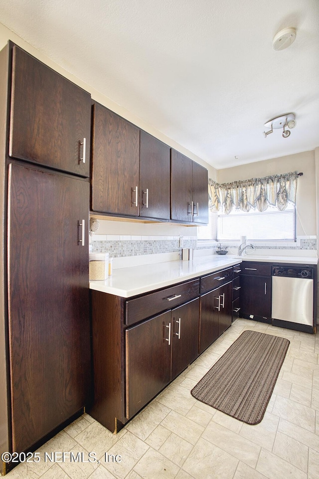 kitchen with dark brown cabinetry, dishwasher, and light countertops