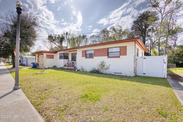 ranch-style house featuring crawl space, a front yard, and a gate