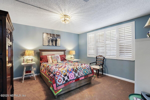 bedroom with baseboards, carpet floors, and a textured ceiling