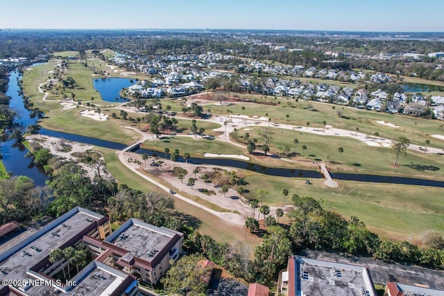 aerial view featuring a water view and view of golf course