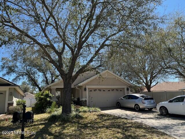 view of front facade with driveway and a garage