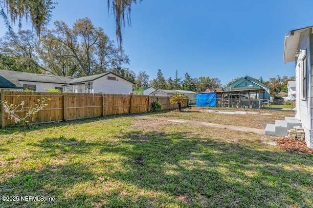 view of yard featuring a fenced backyard