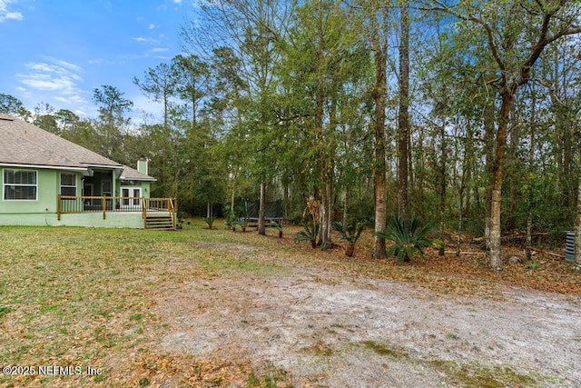 view of yard featuring a deck