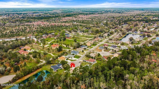 aerial view with a residential view and a water view