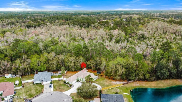 bird's eye view featuring a wooded view