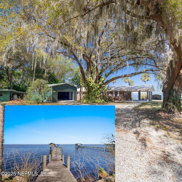 view of swimming pool featuring an outbuilding, a dock, and a water view