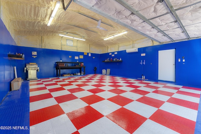 garage with a wall mounted air conditioner