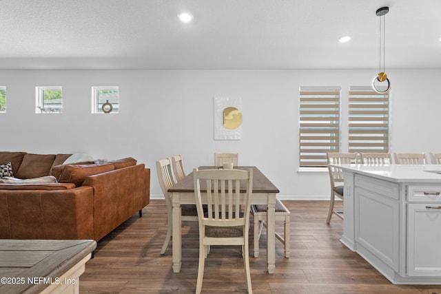 dining space with recessed lighting, dark wood-style floors, and baseboards