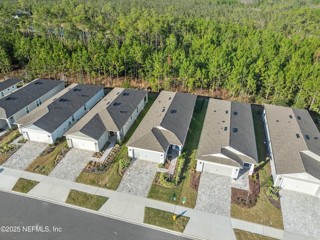 bird's eye view featuring a residential view and a view of trees