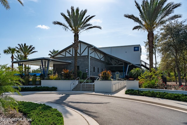 view of building exterior with a fenced front yard