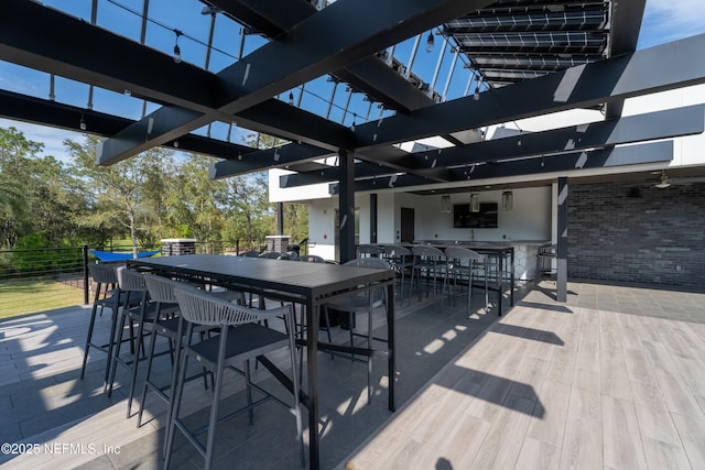 view of patio featuring a pergola and outdoor dining area