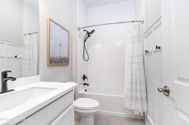 bathroom with toilet, shower / bath combo with shower curtain, tile patterned flooring, and vanity