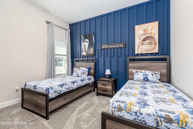 bedroom with baseboards and carpet floors