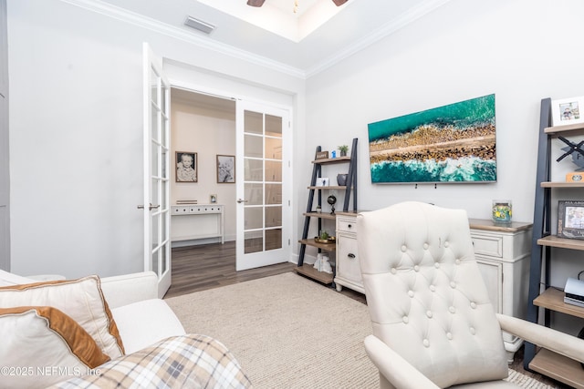 office with visible vents, ornamental molding, ceiling fan, wood finished floors, and french doors