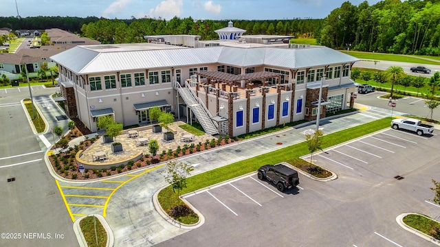 birds eye view of property with a wooded view