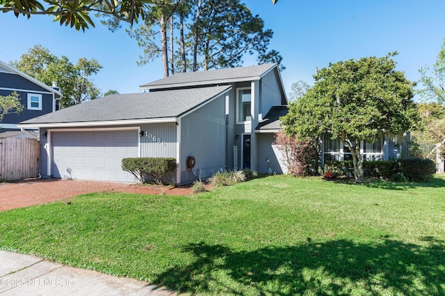 view of property exterior with driveway, a lawn, an attached garage, and fence