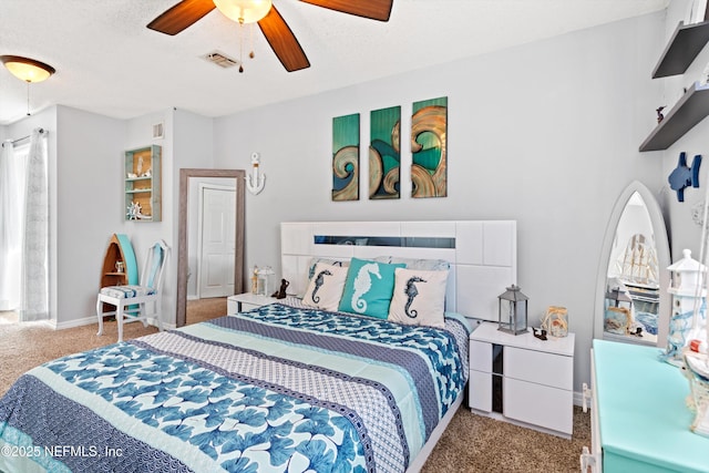 bedroom with a textured ceiling, visible vents, carpet floors, and ceiling fan