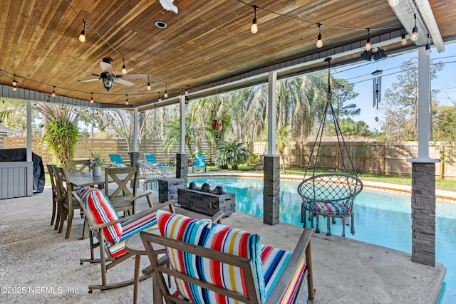 view of patio with a fenced in pool, outdoor lounge area, a fenced backyard, outdoor dining space, and a ceiling fan