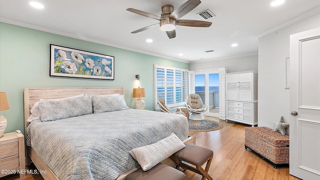 bedroom with recessed lighting, visible vents, crown molding, and light wood finished floors