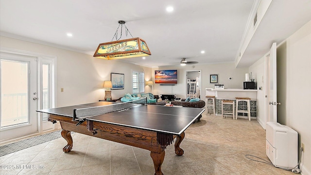 rec room featuring recessed lighting, ornamental molding, light tile patterned flooring, and ceiling fan