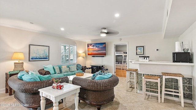 living area featuring recessed lighting and crown molding