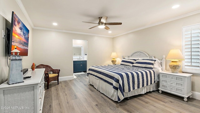 bedroom with crown molding, baseboards, and light wood-type flooring