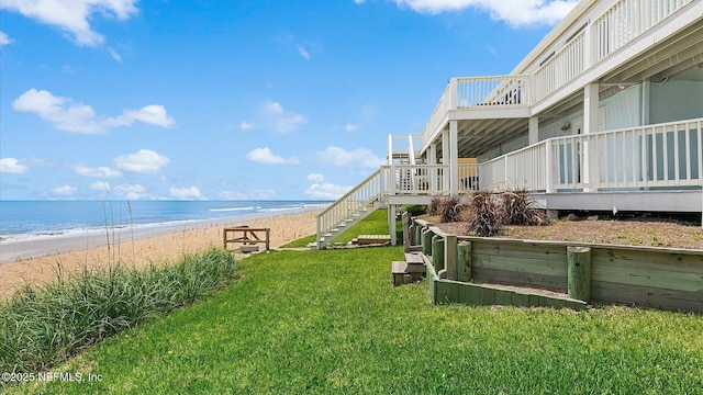 property view of water with stairs and a view of the beach