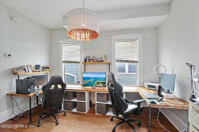 office with plenty of natural light, wood finished floors, baseboards, and a chandelier