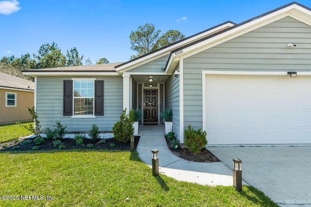 ranch-style home featuring a front yard and an attached garage