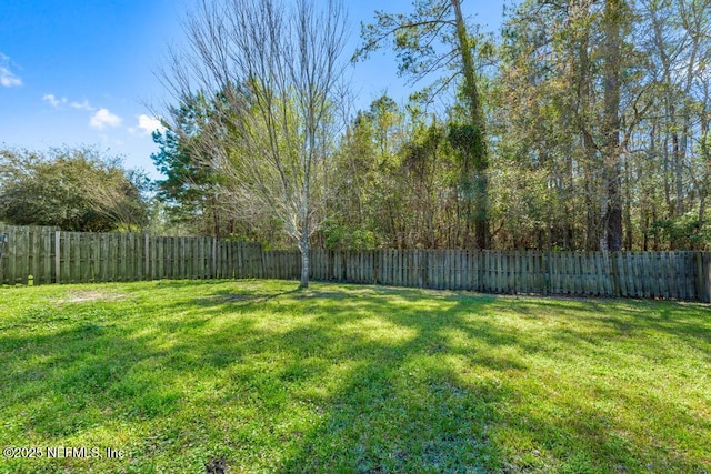 view of yard featuring a fenced backyard