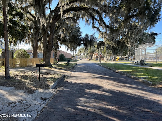 view of street featuring curbs