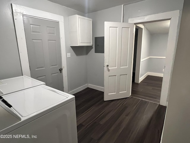 clothes washing area with washing machine and clothes dryer, dark wood finished floors, cabinet space, and baseboards