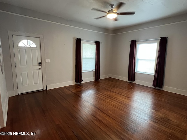 entryway featuring wood finished floors, baseboards, and ceiling fan